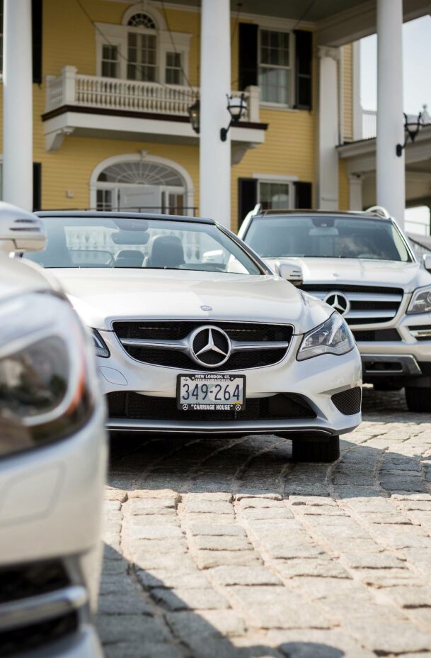 Four cars parked in front of Ocean House Hotel.