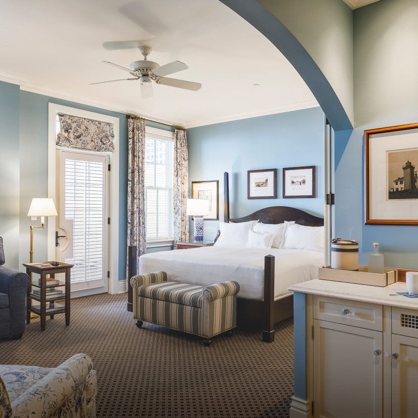 A hotel room with blue walls.