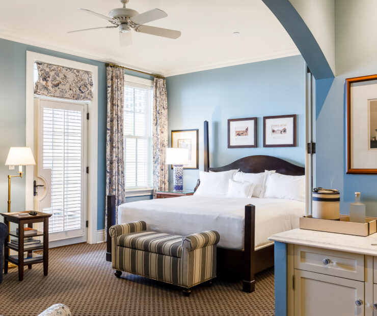 A hotel room with blue walls.