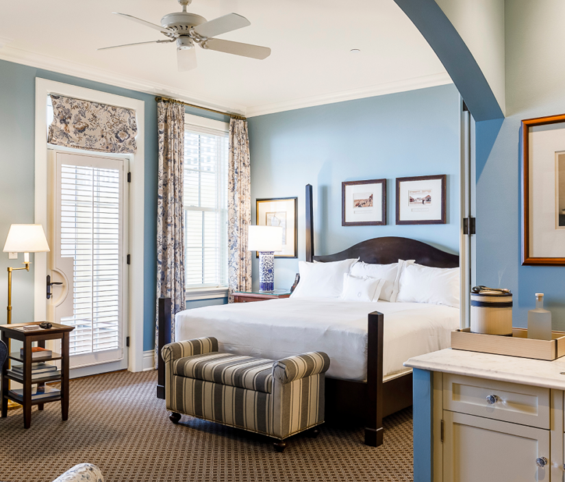 A hotel room with blue walls.