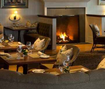 A dining area with a fireplace.