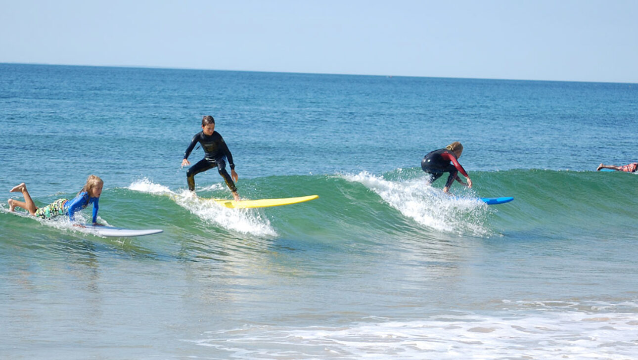 Surfers riding waves.