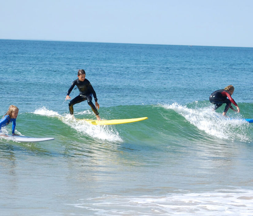 Surfers riding waves.