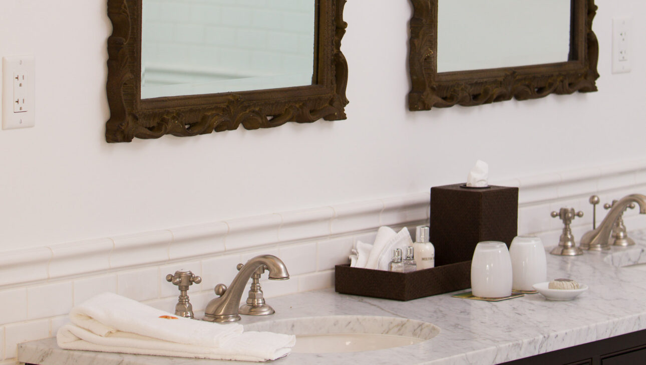 Two sinks and mirrors in the Beach Rose Suite.