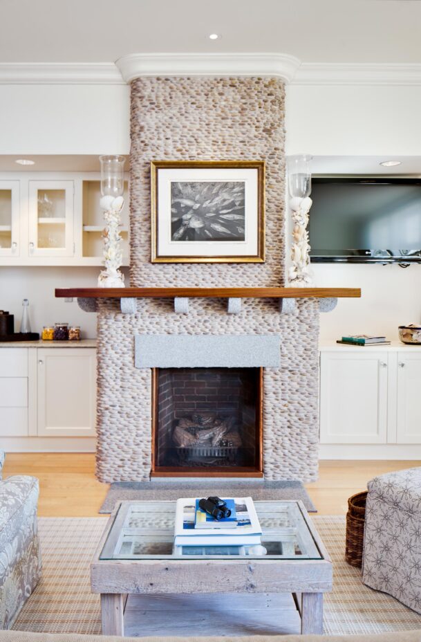 A coffee table and fireplace in the Block Island Suite.