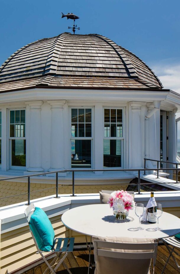 Carousel Suite veranda with a dining table and ocean view.