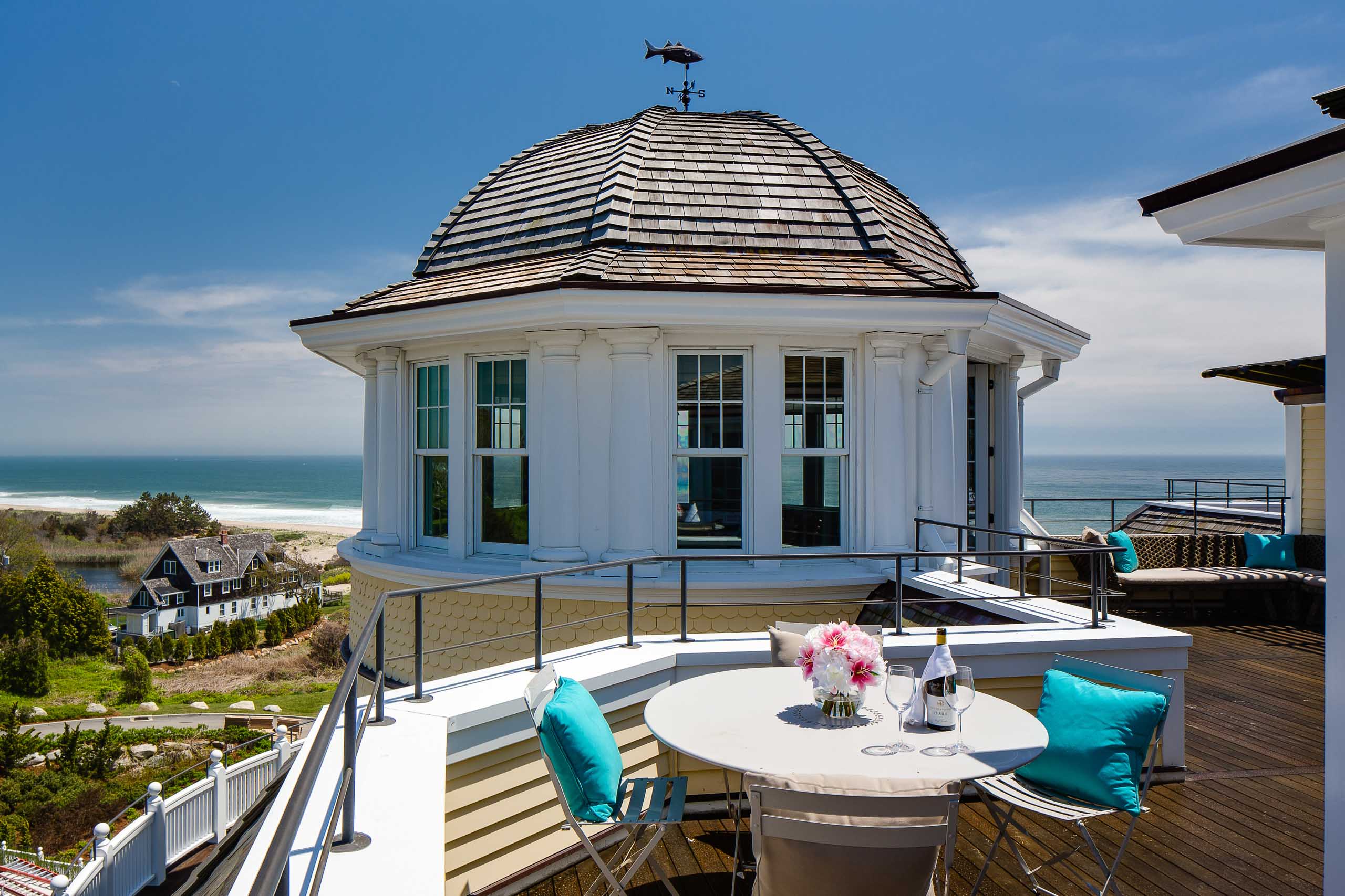 Carousel Suite veranda with a dining table and ocean view.