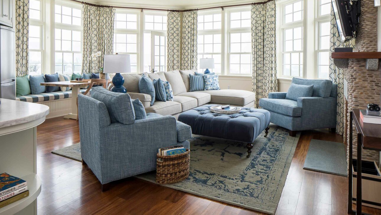 East Beach Suite living room with blue couches.