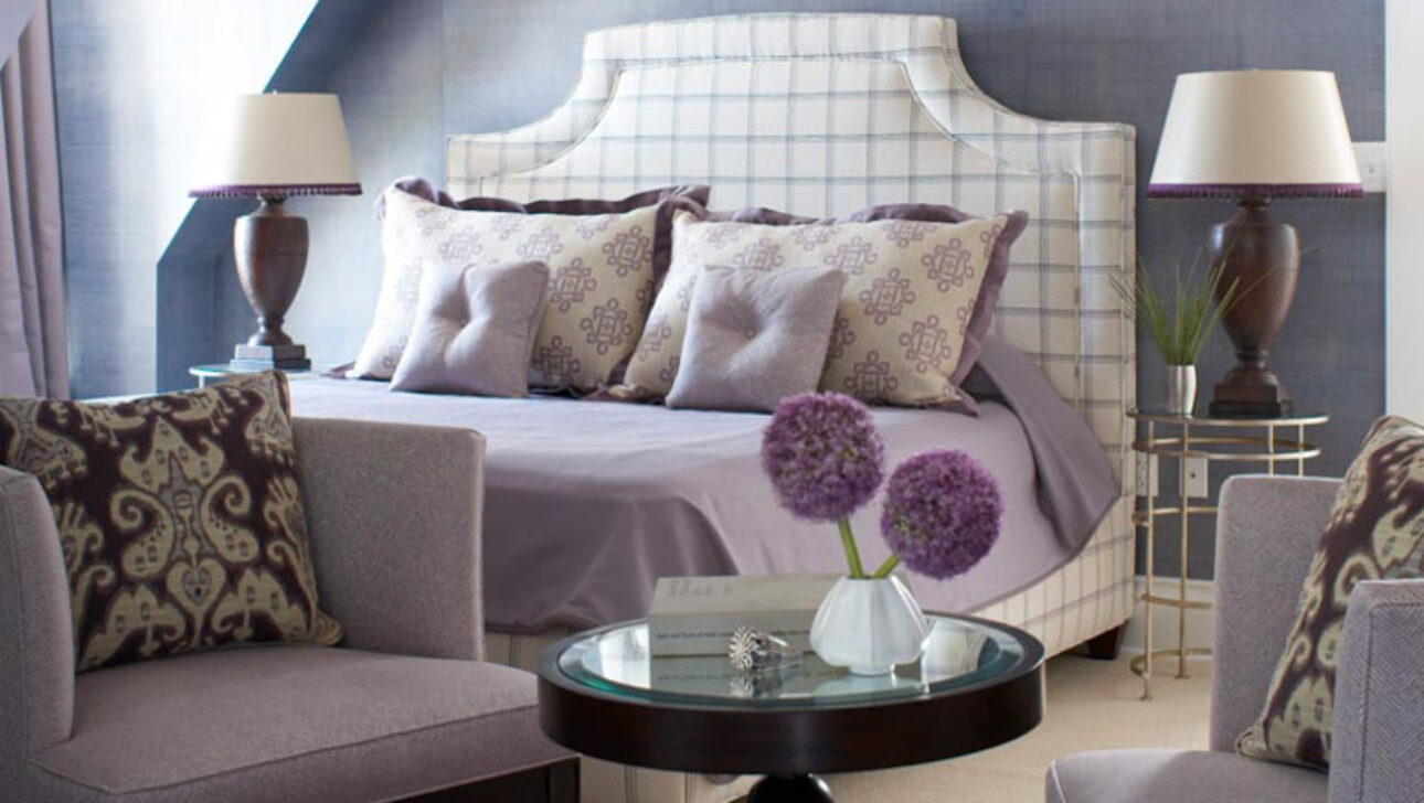 Lighthouse Suite bedroom with purple bedding.