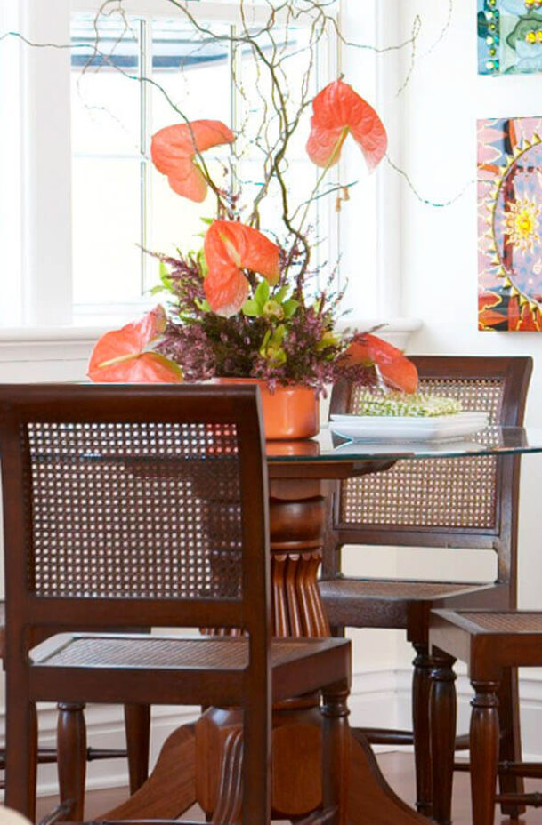 Napatree Suite dining table with orange flowers.