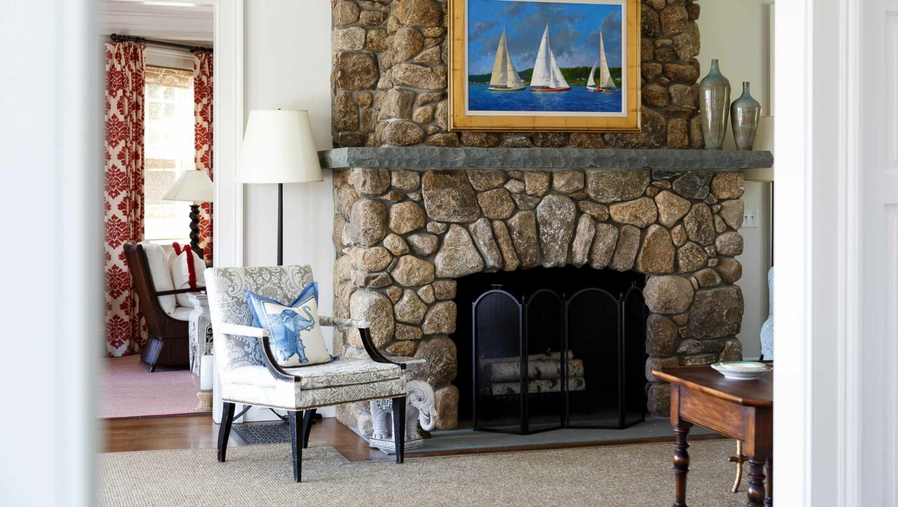 A fireplace in the living room of the Fairways cottage.