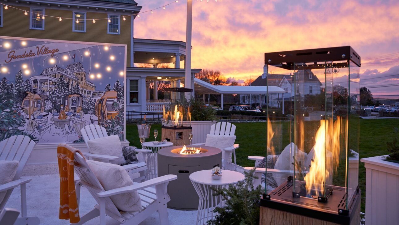 An outdoor lounge area with a fire pit.