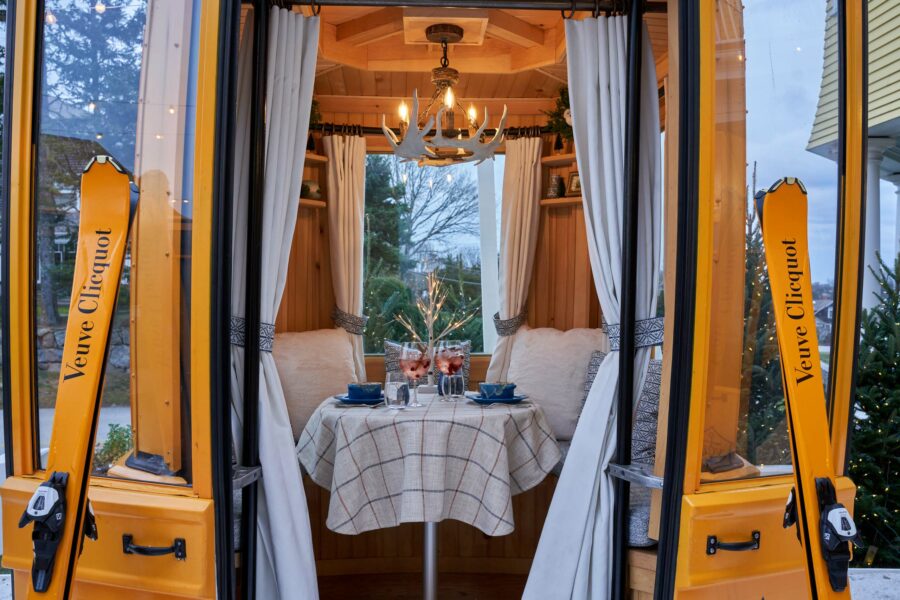 A gondola with a set dining table inside.