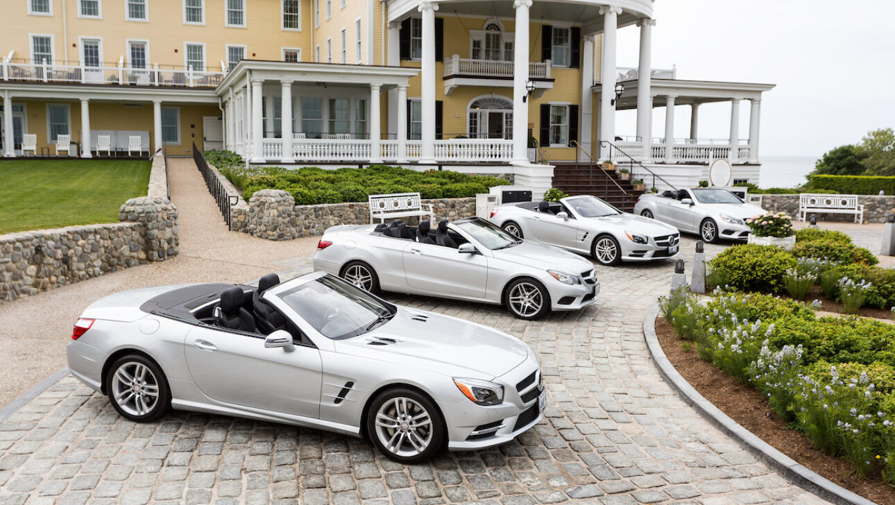 Mercedes Benz cars parked in front of Ocean House Hotel.