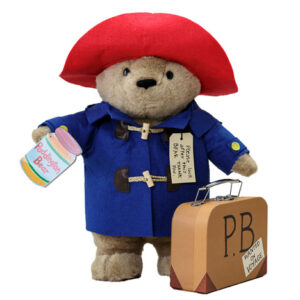 Paddington bear plush with toy suitcase.