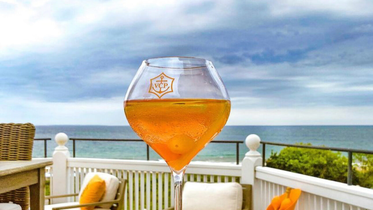 A cocktail on a table outside.