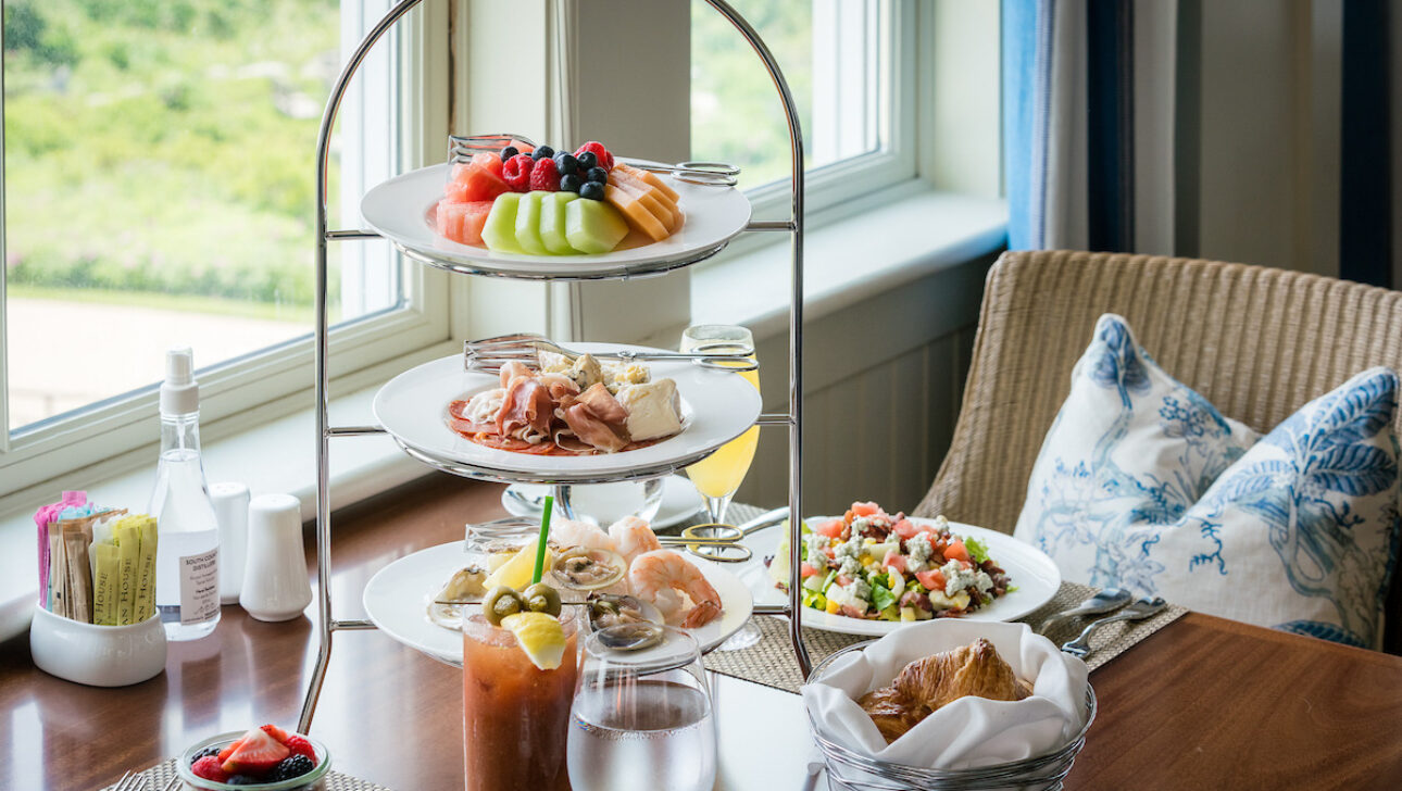 A dining table set with assorted dishes for Sunday Jazz Brunch.