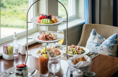 A dining table set with assorted dishes for Sunday Jazz Brunch.