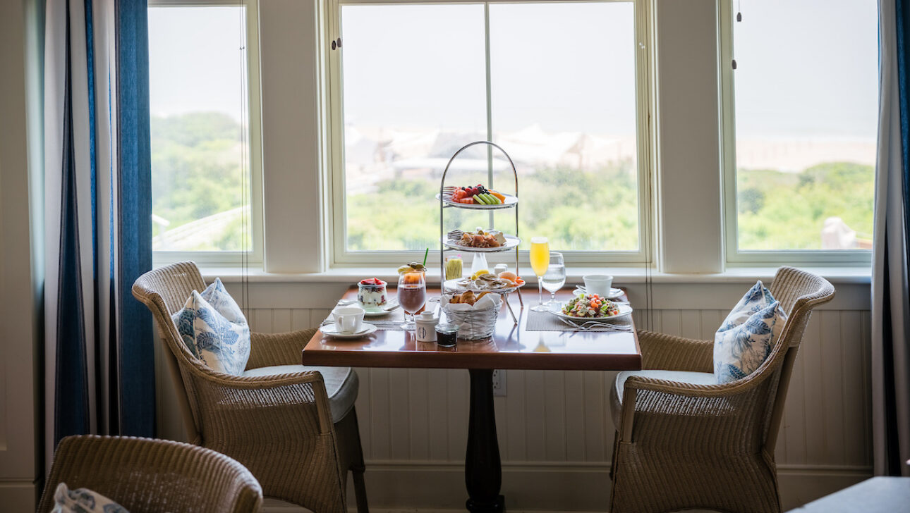 A set dining table near a window for Sunday Jazz Brunch.