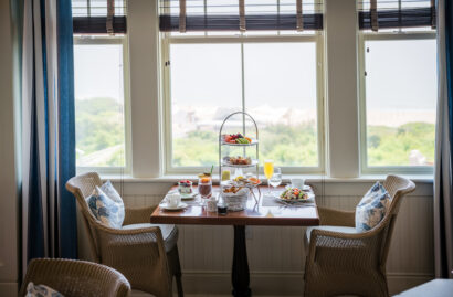 A set dining table near a window for Sunday Jazz Brunch.