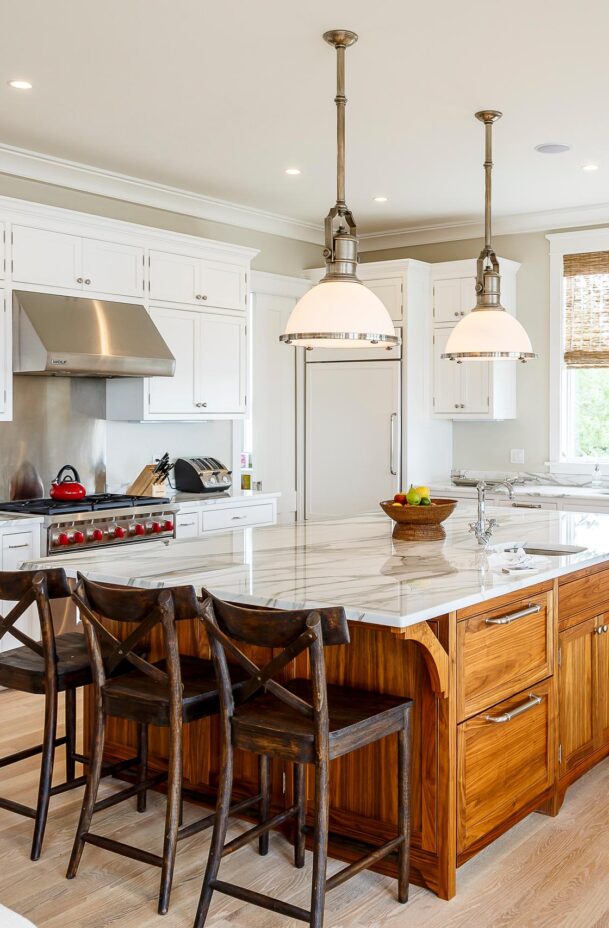 Sunset Cove kitchen and dining area with an island and seats.