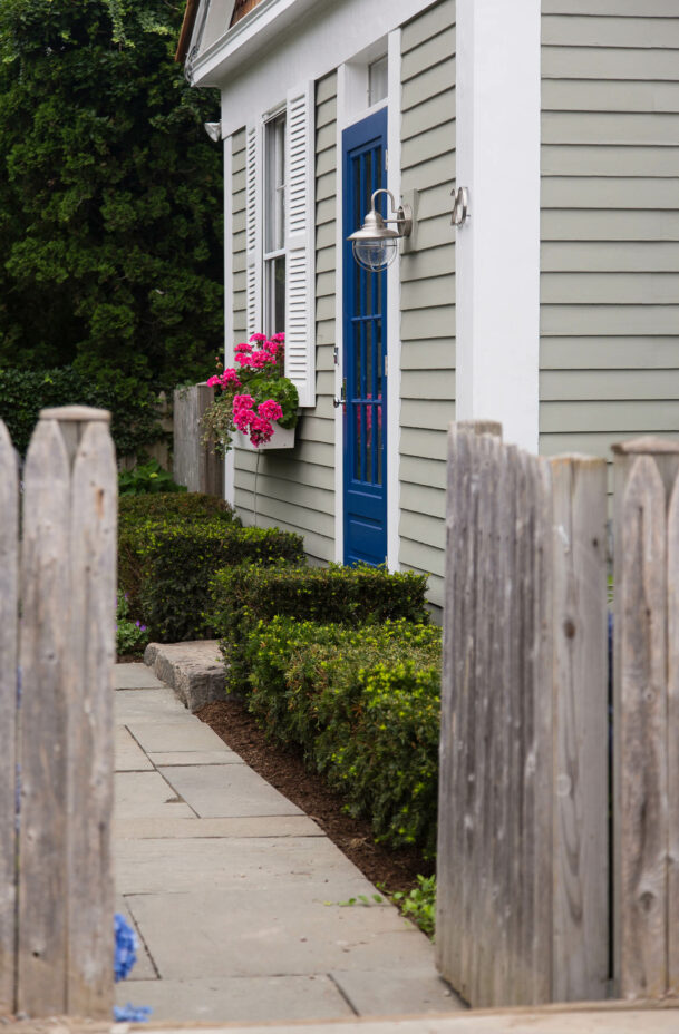 A path leading to the entrance of the School House cottage.